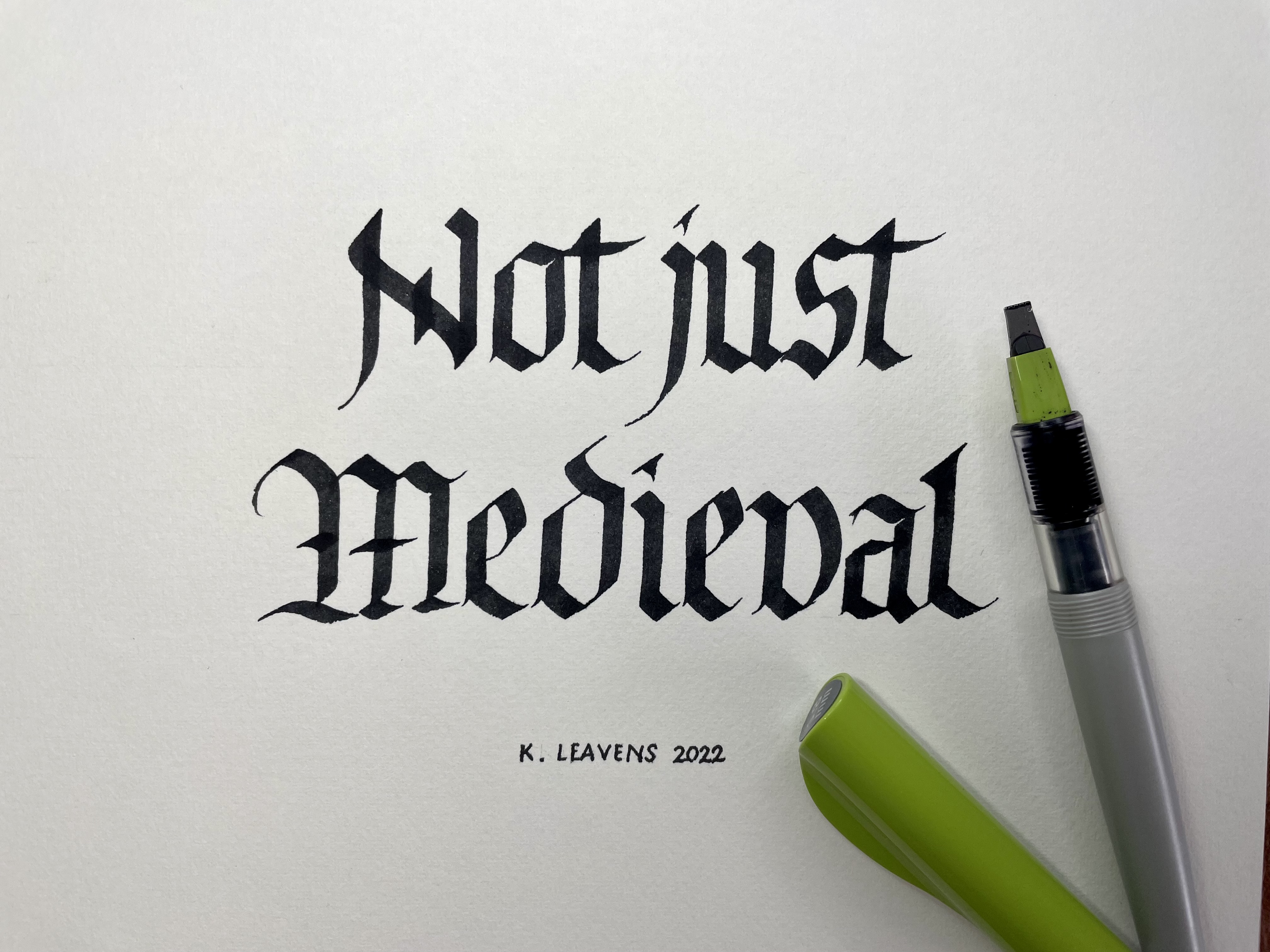 "Not just medieval" blackletter calligraphy by Katie Leavens with green-topped parallel pen