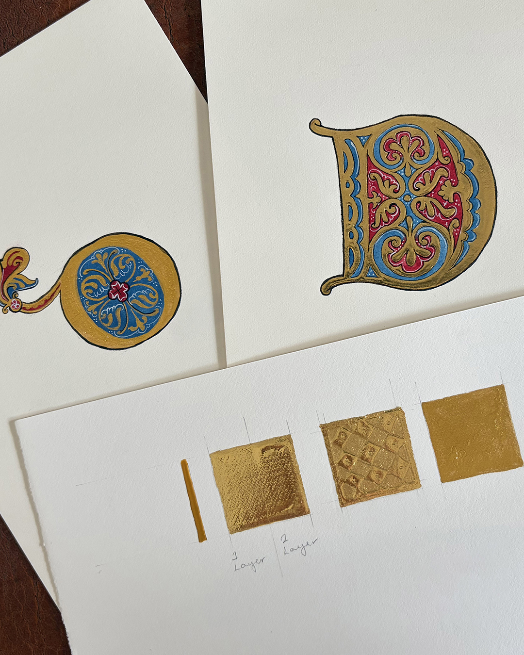 gilded square tests and 2 types different gilded Ds in medival style
