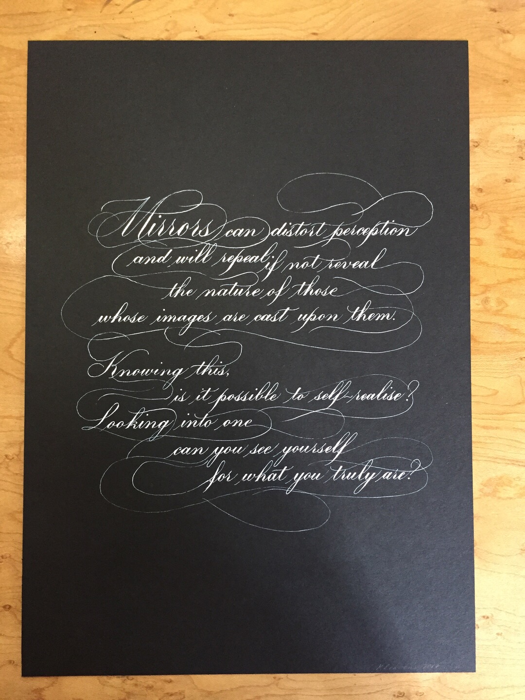 Calligraphic quote white on black by Katie Leavens