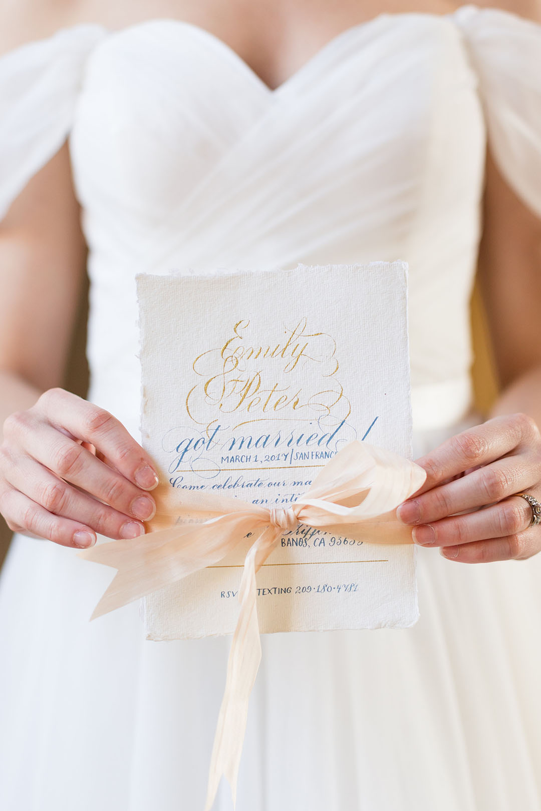 Bride holding elopement announcement